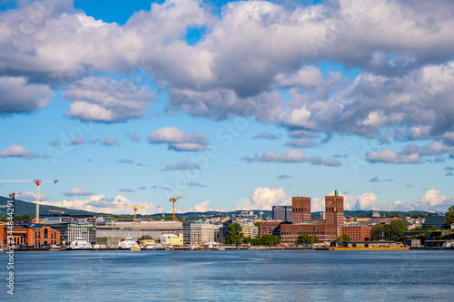 Oslo, Norway - Panoramic view of Oslo waterfront with City Hall, Aker Brygge and Tjuvholmen borough at Pipervika harbor © Art Media Factory