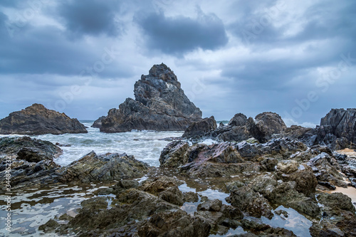 Wallpaper Mural Long Exposure of rocks at the beach of the Camel Rock bay in New South Wales, Australia at a cloudy and windy day in summer with strong waves in the ocean.  Torontodigital.ca