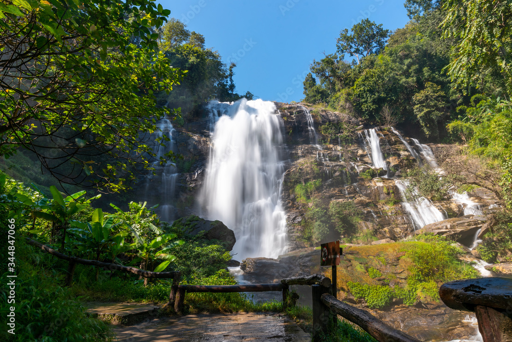 Fototapeta premium Beautiful landscape view of waterfall in Thailand in natural park with blue sky