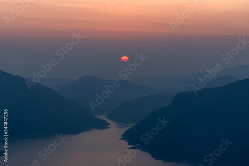 Landscape view of beautiful sunrise on big river and mountain view point