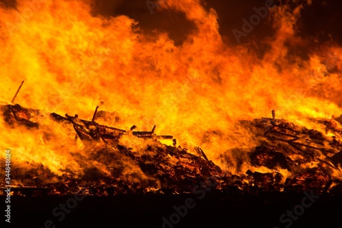 Great bonfire with big flames in a very dark night.