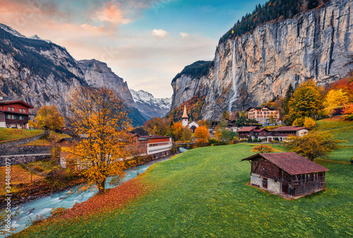 Impressive outdoor scene of Swiss Alps, Bernese Oberland in the canton of Bern, Switzerland, Europe. Magnificent autumn sunrise in Lauterbrunnen village. Beauty of countryside concept background. photo