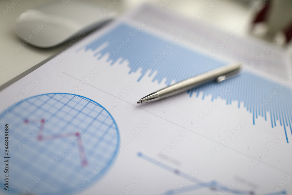 Close-up of pen lying on bar chart. Chief manager preparing financial statement for conversation. Work in corporation. Business meeting and company concept Close-up of pen lying on bar chart. Chief manager preparing financial statement for conversation. Work in corporation. Business meeting and company concept