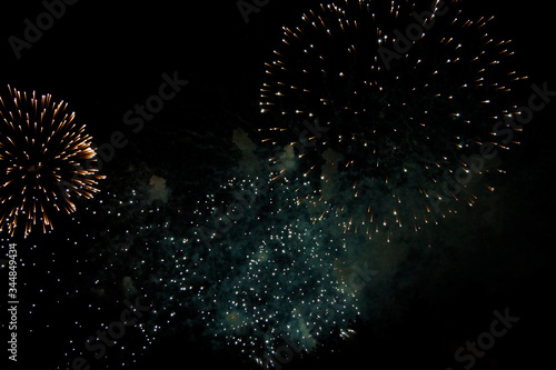 Celebration firework in the black night sky