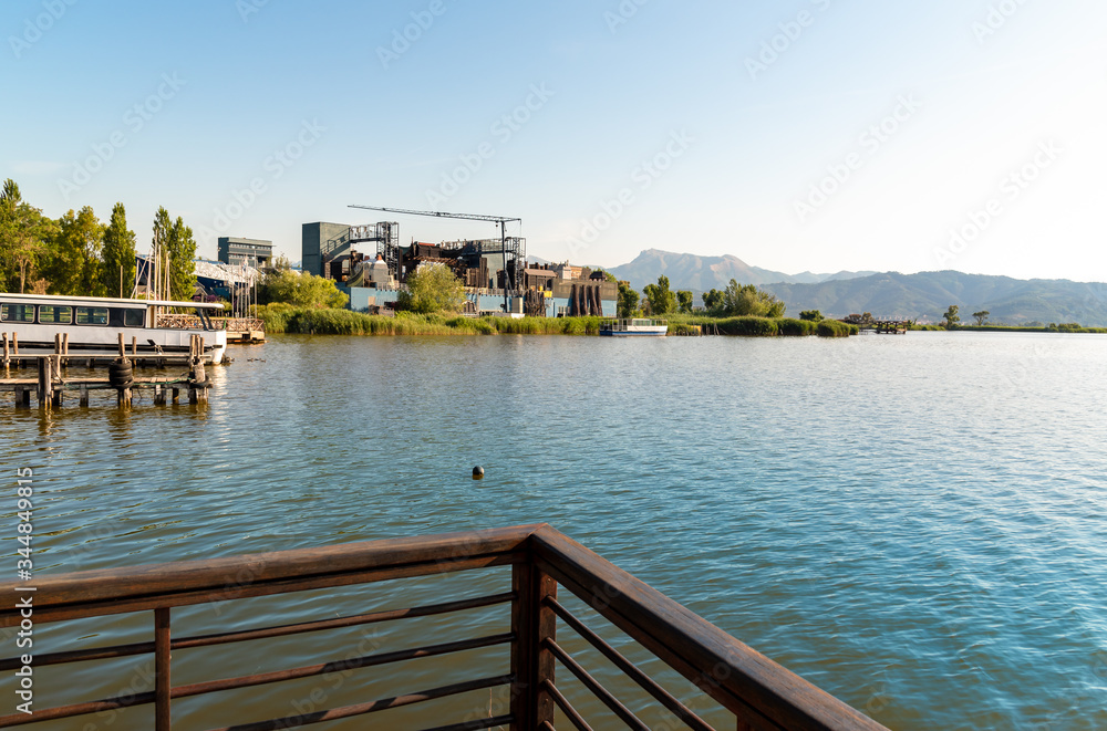 Landscape of Lake Massaciuccoli with the open-air Giacomo Puccini Grand Theater, located in Torre del Lago Puccini in Viareggio, Tuscany, Italy Landscape of Lake Massaciuccoli with the open-air Giacomo Puccini Grand Theater, located in Torre del Lago Puccini in Viareggio, Tuscany, Italy