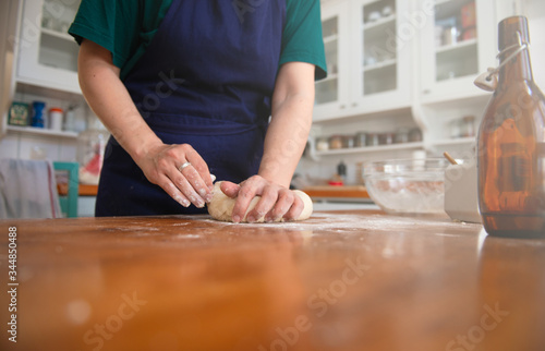 Woman making dough at home