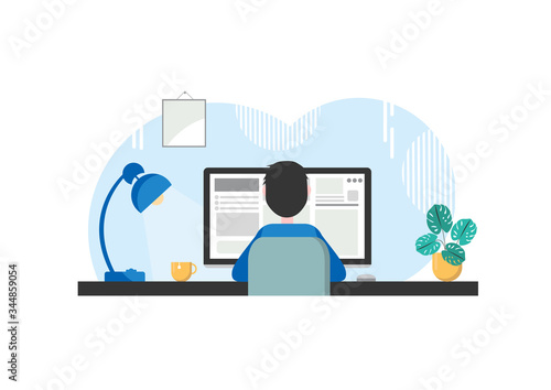 Man is working at the computer. This is a programmer or student or freelancer. Or a person works from a home office or telework