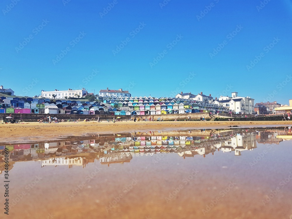 Stock photo of a colourful view of the sea shore of the Essex small town Walton-on-the-Naze reflected in the sea water, with copy space. Stock photo of a colourful view of the sea shore of the Essex small town Walton-on-the-Naze reflected in the sea water, with copy space.