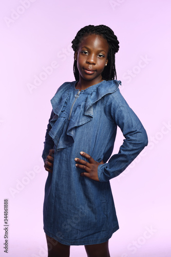 Young black girl in denim dress photo