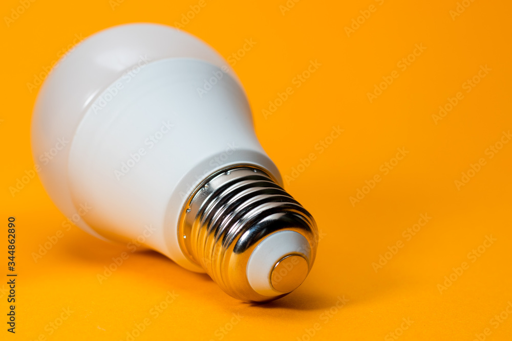 LED, New technology light bulb on yellow background, Energy super saving electric lamp is good for environment LED, New technology light bulb on yellow background, Energy super saving electric lamp is good for environment