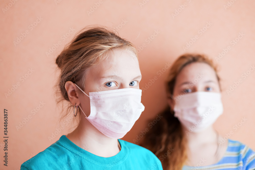  Two girls in  medical masks