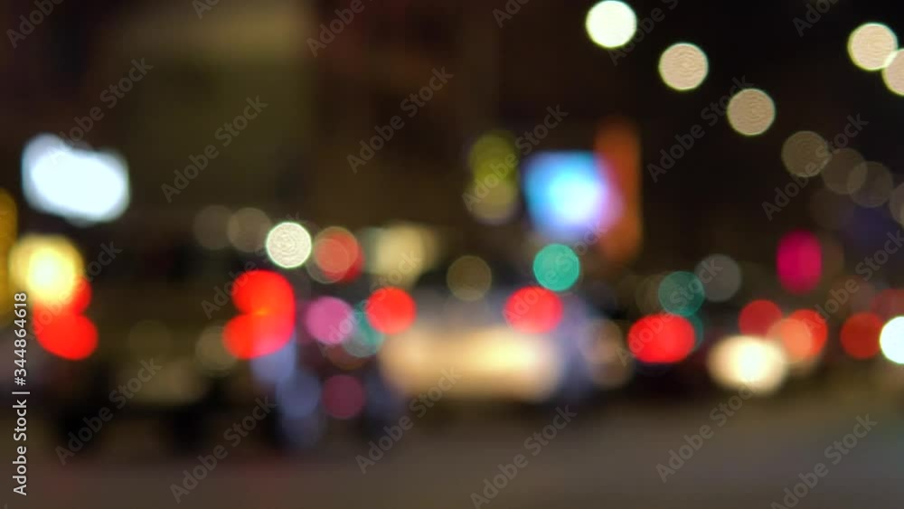 Defocused Milano traffic lights and cars at night. Blurred image of Milan, street - Corso Buenos Aires. Famous shopping street. Defocused Milano traffic lights and cars at night. Blurred image of Milan, street - Corso Buenos Aires. Famous shopping street.