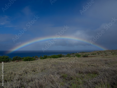 Rainbow in Hawaii over Pacific Ocean