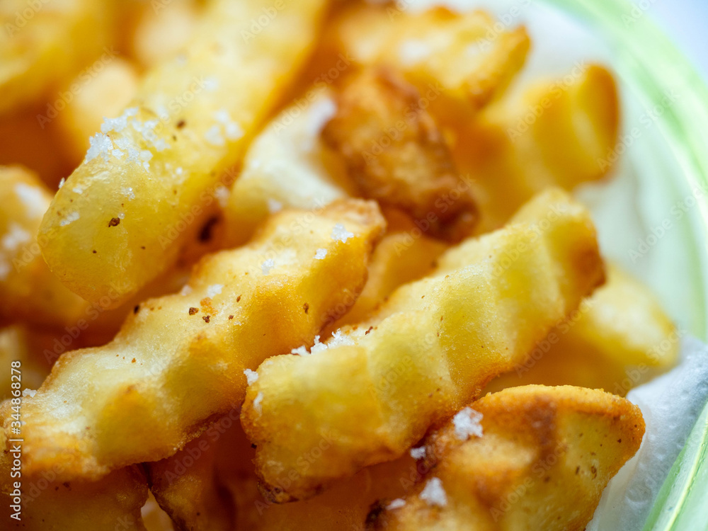 French fries golden brown, fried with oil and sprinkled with salt, sweet and salty French fries golden brown, fried with oil and sprinkled with salt, sweet and salty