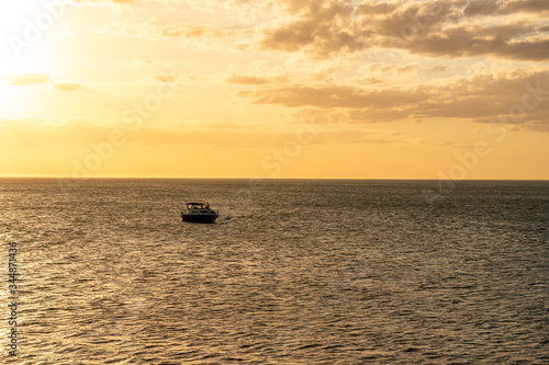 fishing boat at sunset © ezequiel.niu