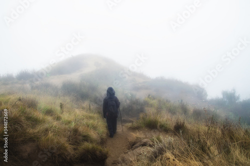 man walking in fog © Hadiyat