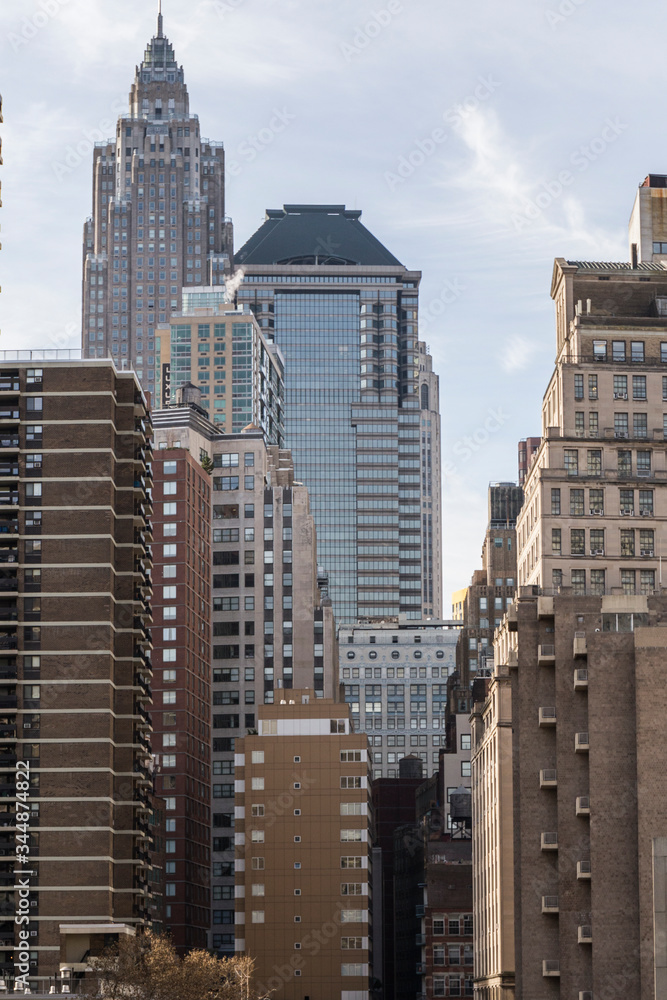 Fototapeta premium New York City skyscrapers from within Manhattan, tall, modern buildings with many windows