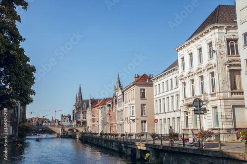 GHENT, BELGIUM - August, 2019: Graslei is a dock in the historic city center of Ghent, Belgium in summer before cornoa crisis. © Aitor