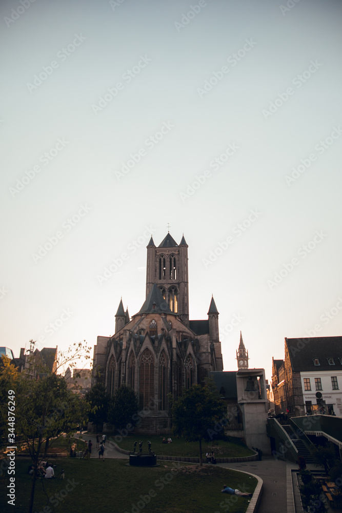 Fototapeta premium GHENT, BELGIUM - August, 2019: Medieval city of Gent (Ghent) in Flanders with Saint Nicholas Church and Gent Town Hall, Belgium. Sunset cityscape of Gent. Before Corna Crisis