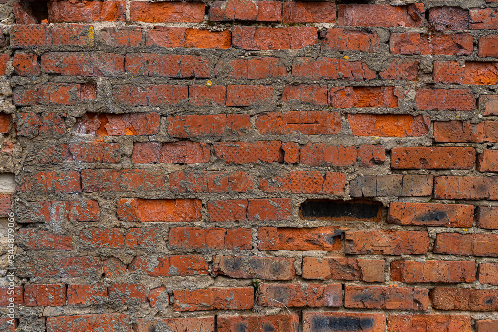 Fototapeta premium old crumbling abandoned brick wall