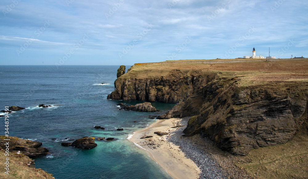 sandy beach on the rugged caithness coast at Noss Head