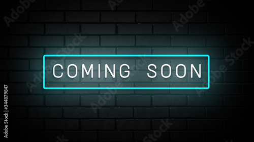 Coming Soon neon sign. white and blue glow. neon text. on brick wall background