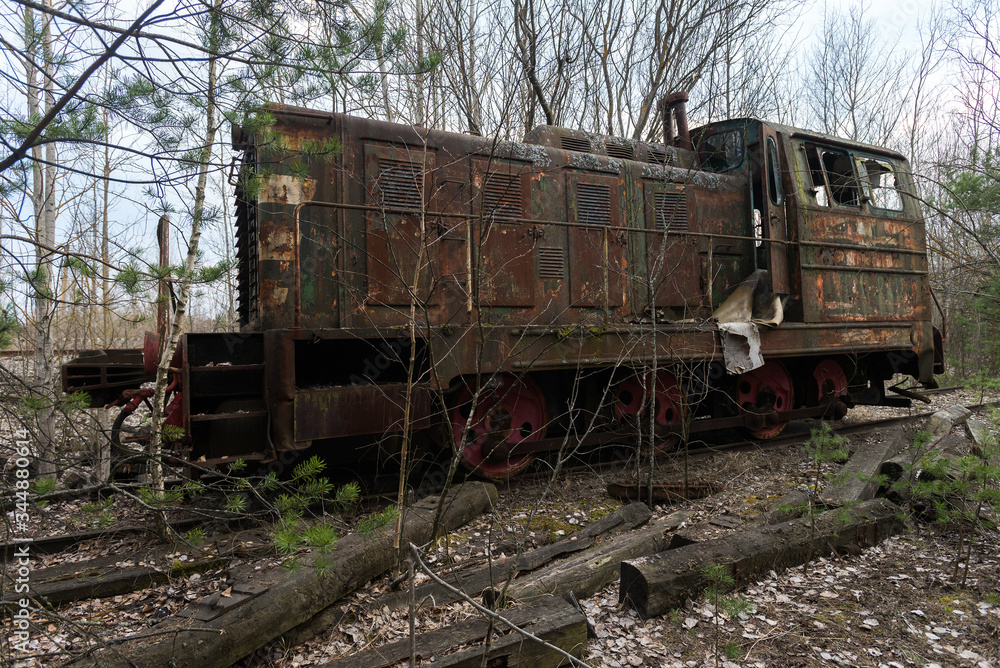 Old radioactive locomotion at abandoned station Yanov near ghost town Pripyat