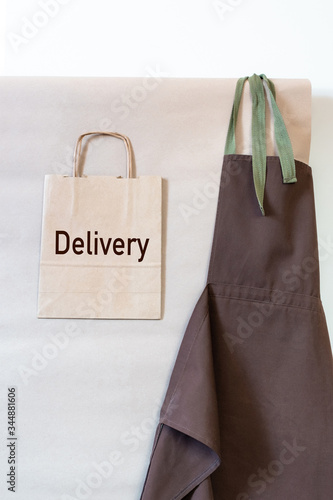 delivery service bag apron shipment package blue brown wall copy space