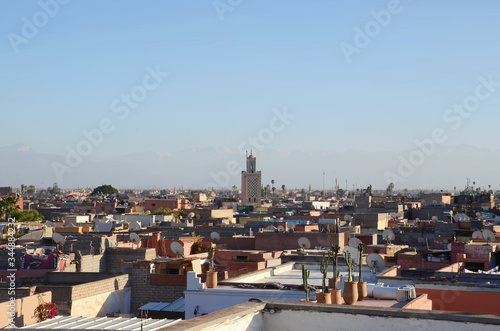 View of marrakech old town from balcony. Marrakesh, a former imperial city in western Morocco, is a major economic center and home to mosques, palaces and gardens. 