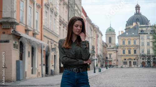 Outdoor close up portrait of young beautiful fashionable woman