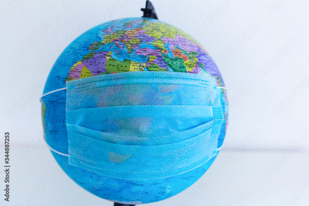 Planet Earth with a protective mask. World medical concept. coronavirus Planet Earth with a protective mask. World medical concept. coronavirus