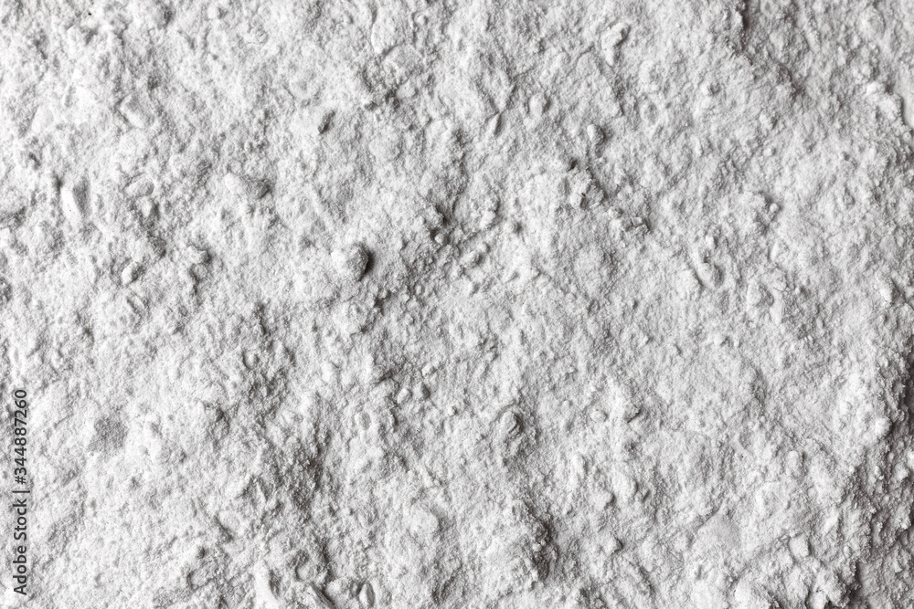 Fototapeta premium Rozsypana mąka na czarnym tle. Czarne tło tekstura