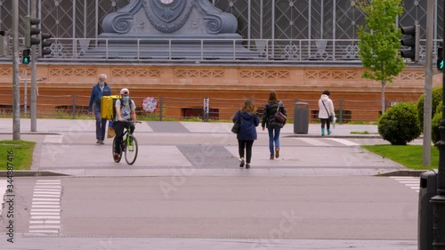 Madrid / Spain-04/19/20 Pedestrians crossing a crosswalk at the Atocha station during confinement in April 2020. Covid 19, coronavirus spain