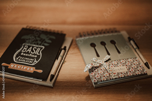 Recipe notebooks on wooden background