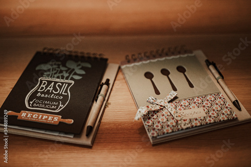 Recipe notebooks on wooden background