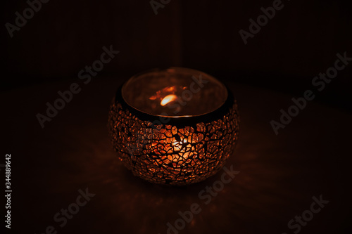 burning candle in the dark