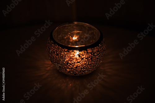 burning candle in a glass