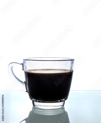 Black coffee in glass on white background.