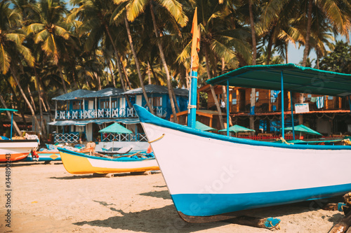 Canacona, Goa, India. Sightseeing Tourist Boats Parked On Famous Palolem Beach In Summer Sunny Day photo