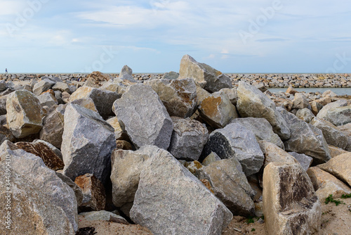 Large stones Was prepared in place of the sandy beach for the wave walls © K.Decha