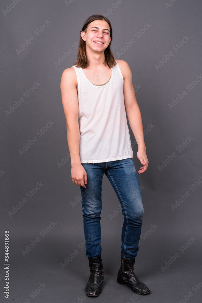 Young handsome androgynous man with long hair Young handsome androgynous man with long hair