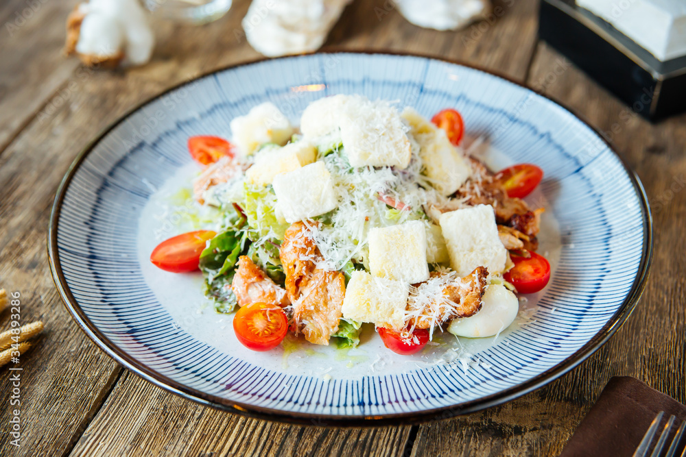 Gourmet appetizing caesar salad with fried chicken Gourmet appetizing caesar salad with fried chicken