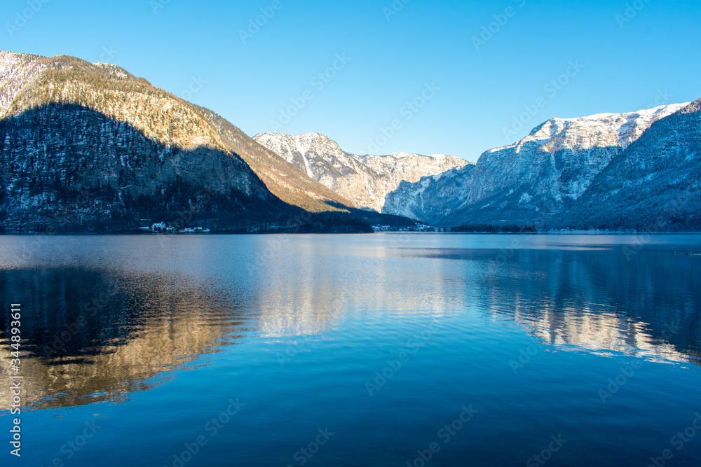 Hallstattersee lake in village Hallstatt western shore in Austria's mountainous Salzkammergut region in winter