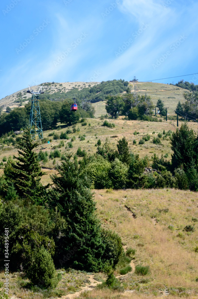 Fototapeta premium Aerosilla in the mountain of Bariloche. Cerro Catedral without snow in summer. Empty spars. Chairlift machine