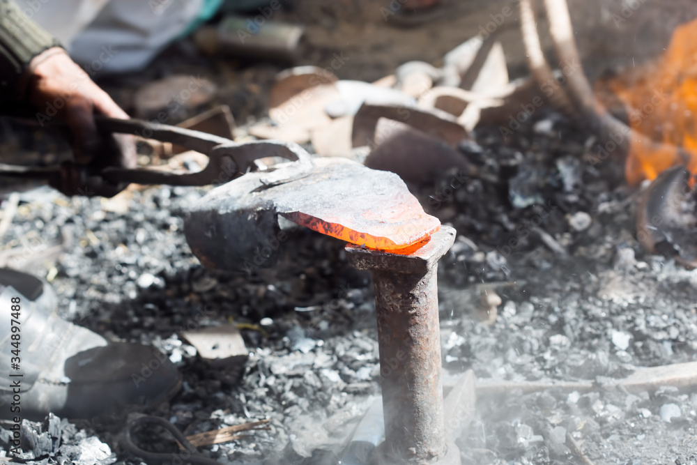 Locksmith. Hardening hot iron, Morocco Locksmith. Hardening hot iron, Morocco
