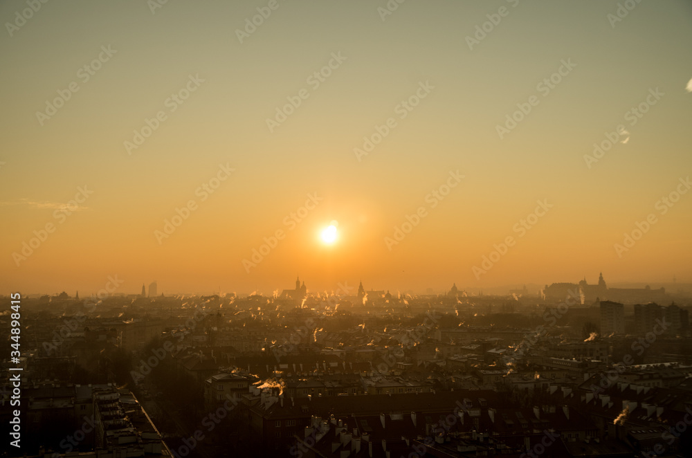 Panorama of Cracow during smog sunrise, Poland