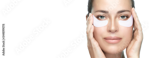 Healthy skin woman using patches under eyes. Beauty and skin care concept.
