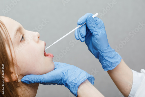 Konstfotografi Pediatrician taking saliva test sample