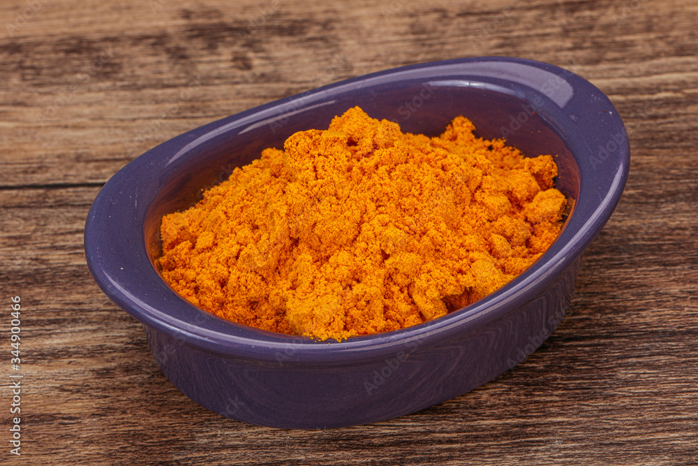 Tumeric powder in the bowl Tumeric powder in the bowl