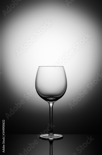 empty wine glass on the lumen with reflection